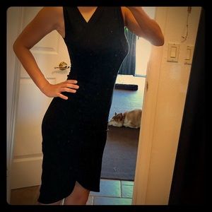 Black cocktail dress with asymmetric neckline